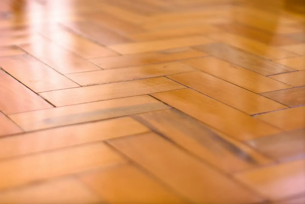 Polished herringbone parquet floor in a character property